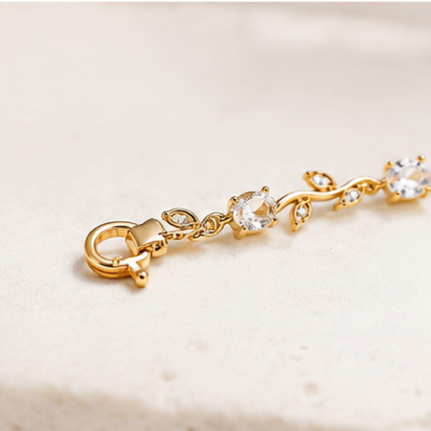 Gold plated stainless steel tulip bracelet with silver CZ stones